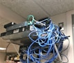 Networking cables and devices laid out on a blue and grey background.