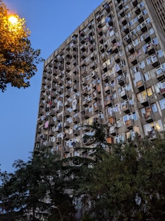 High-rise apartment building with balconies at sunset