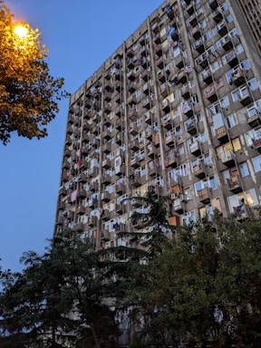 High-rise apartment building with balconies at sunset