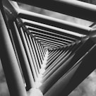 a black and white photo of a metal structure