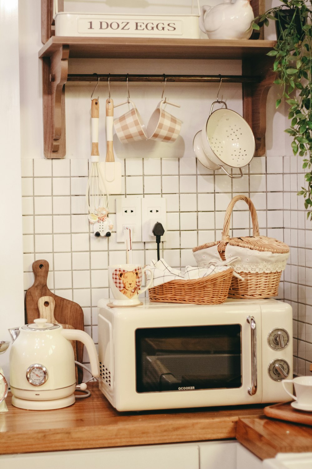 a white microwave oven sitting on top of a wooden counter