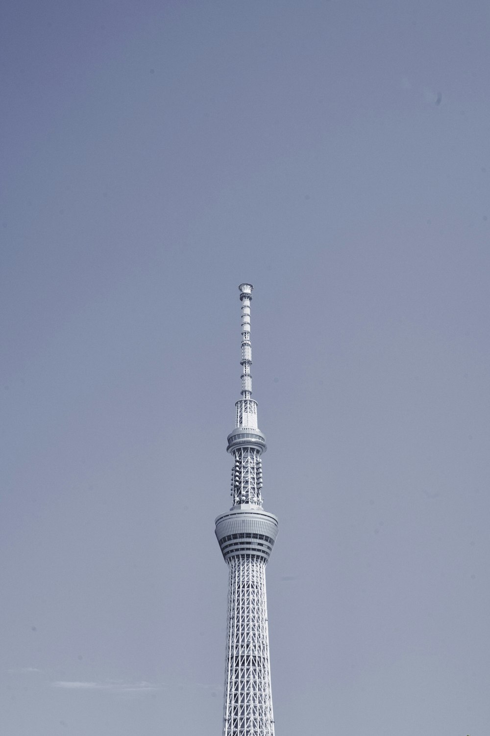 a very tall tower with a clock on it's side