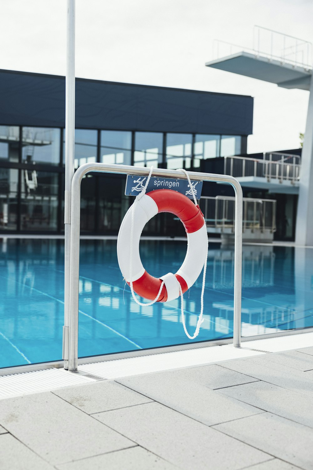 a life preserver on the side of a swimming pool