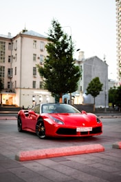 a red ferrari 488 gtb parked in a parking lot on michelin tyrs sold in tyrepublic in lagos