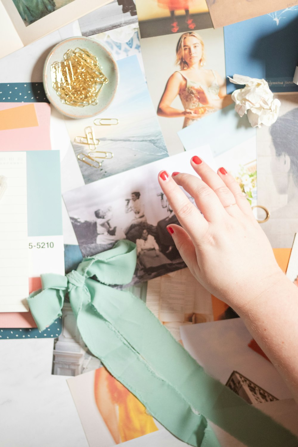 a woman's hand on a piece of paper