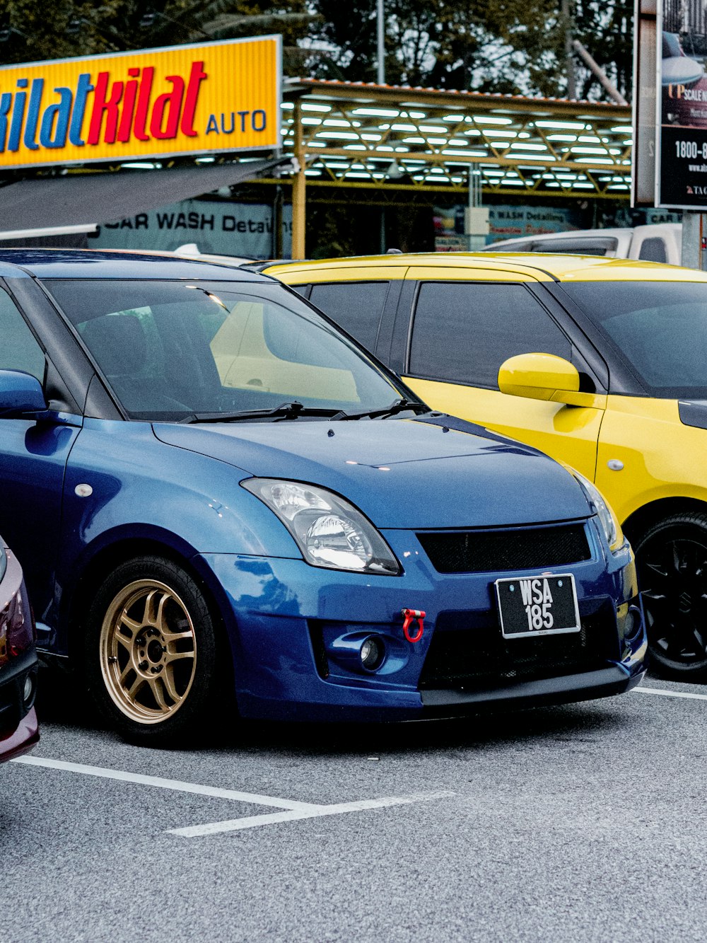 a row of cars parked in a parking lot