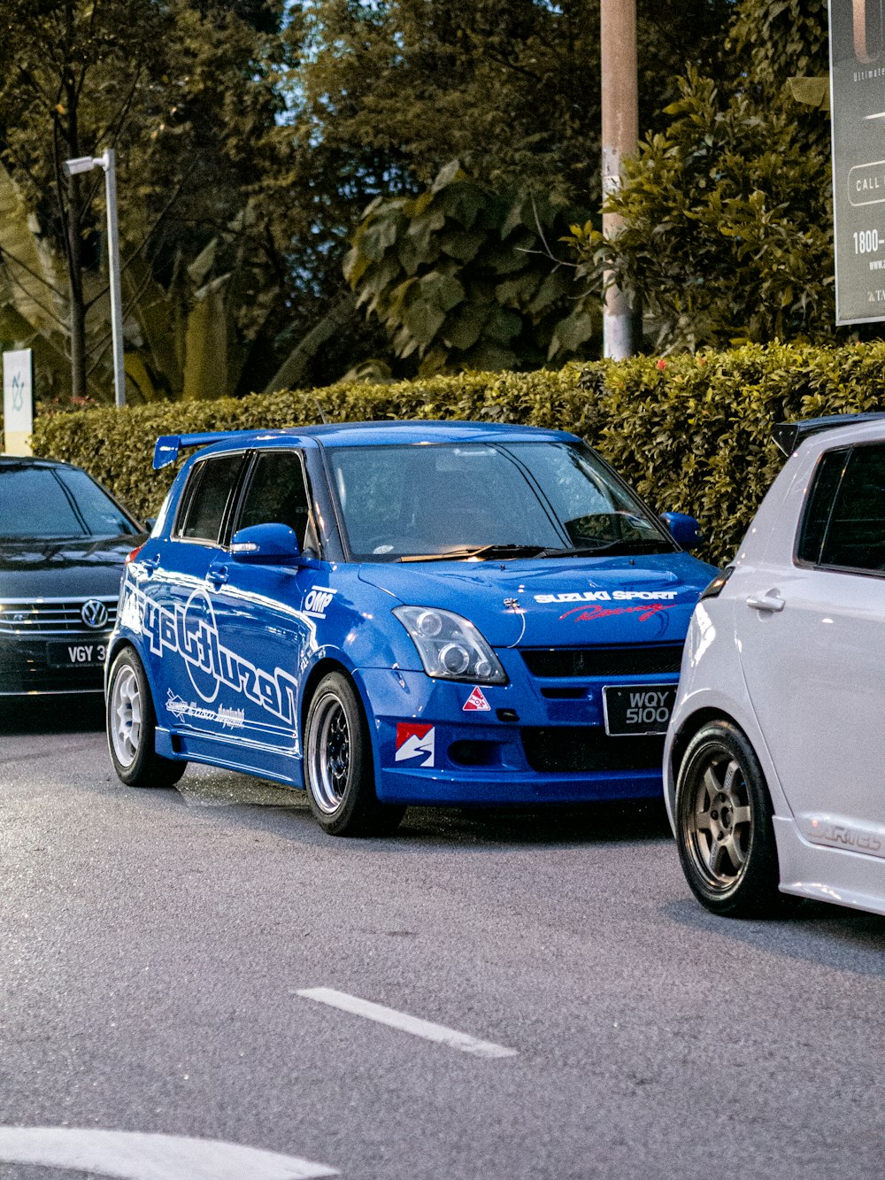 a couple of cars that are sitting in the street