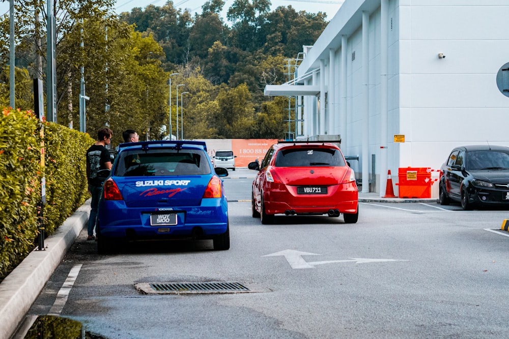 a couple of cars that are sitting in the street