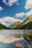 A serene mountain landscape with a tranquil lake reflecting the sky.