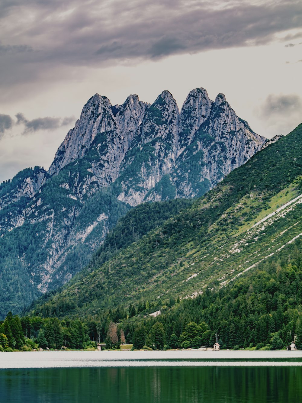 a mountain range with a body of water in front of it