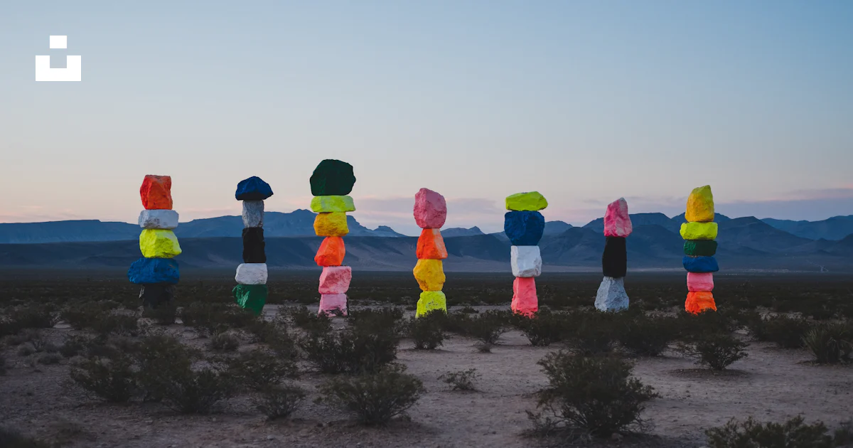 Paper Rocks Colored A number of different colored pieces of paper in the desert photo ...