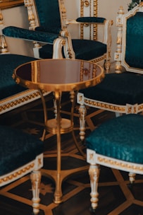 a room with a bunch of chairs and a table