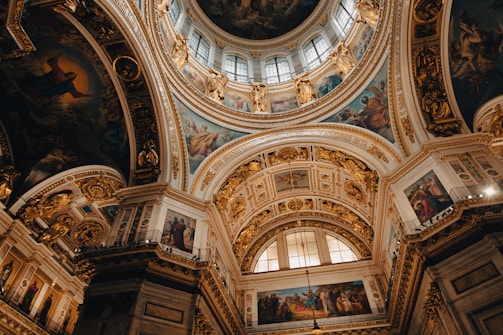 Interior shot capturing the vast dome and ornate decorations inside St. Peter's Basilica.