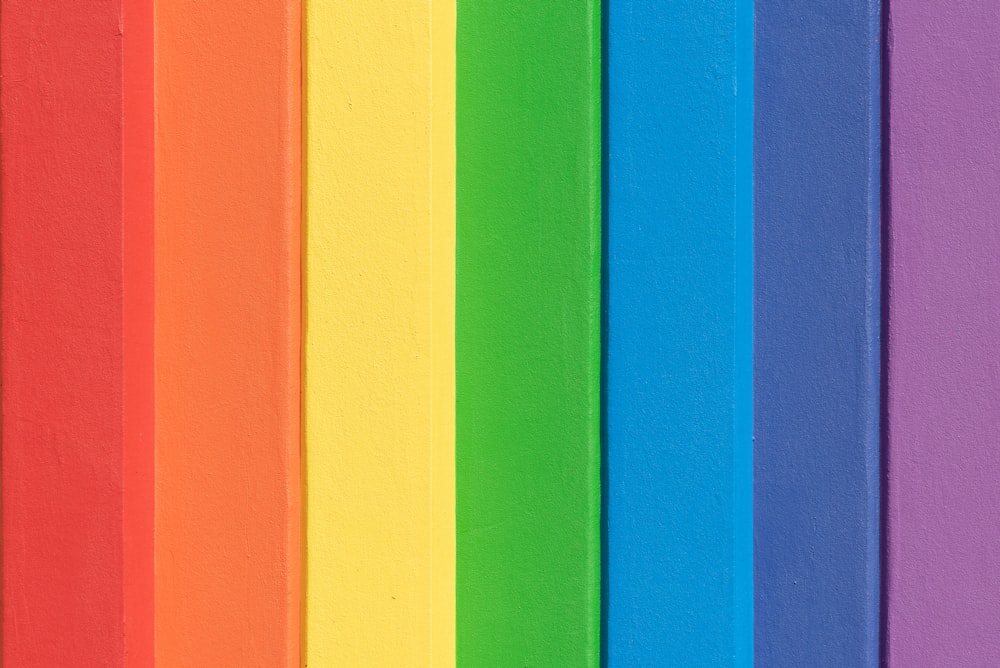 a close up of a rainbow colored wall
