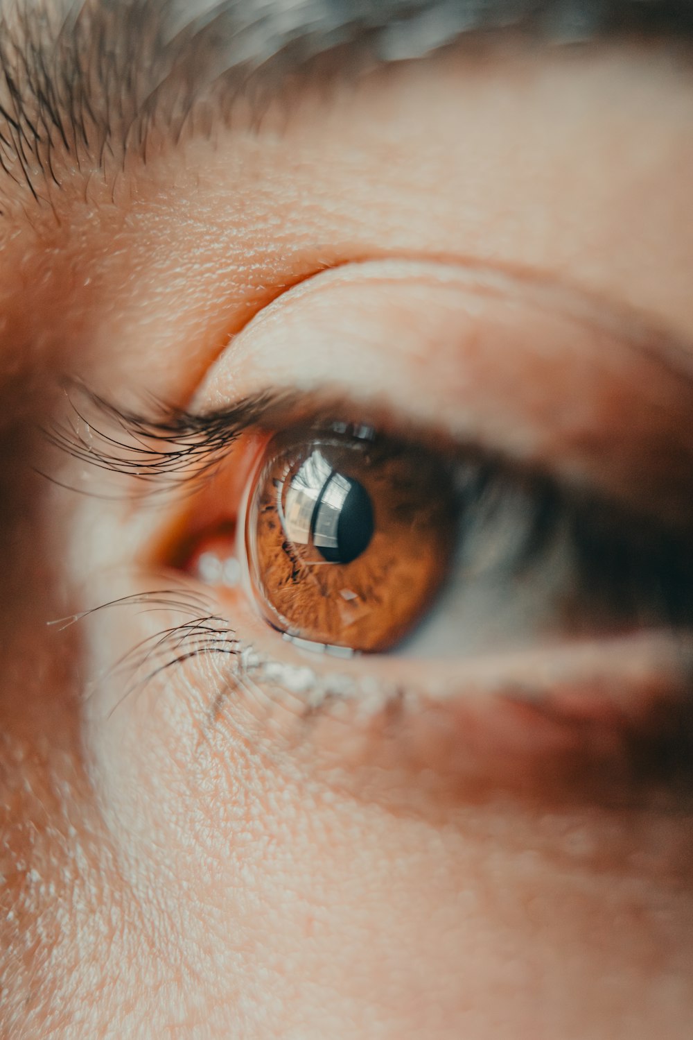 a close up of a person's brown eye