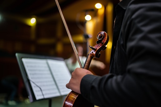 a man holding a violin in his hands