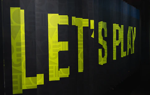 a black wall with yellow letters on it
