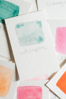 Watercolor story cards fanned out, each featuring gentle animal characters.