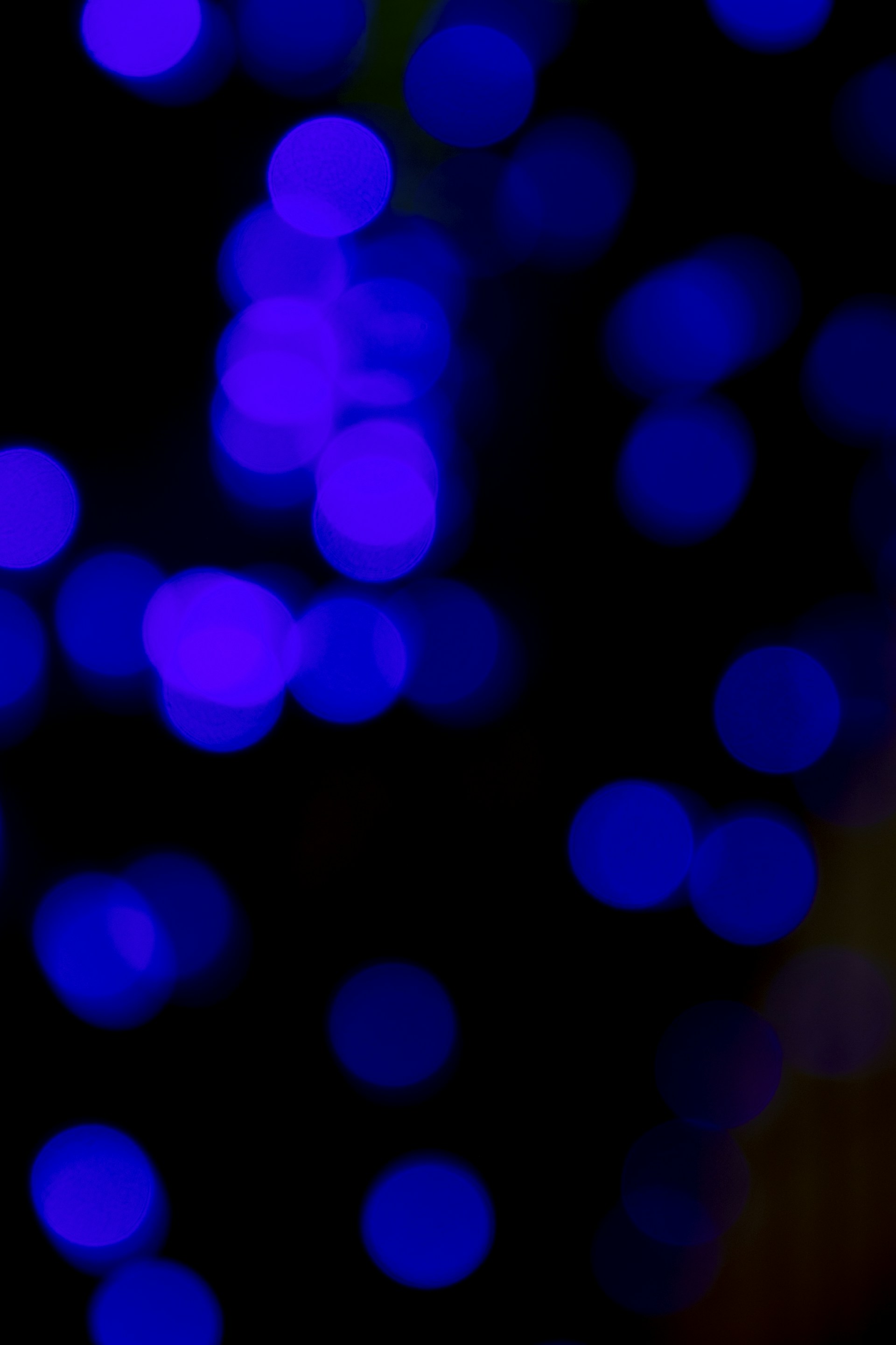 a blurry photo of blue lights in the dark