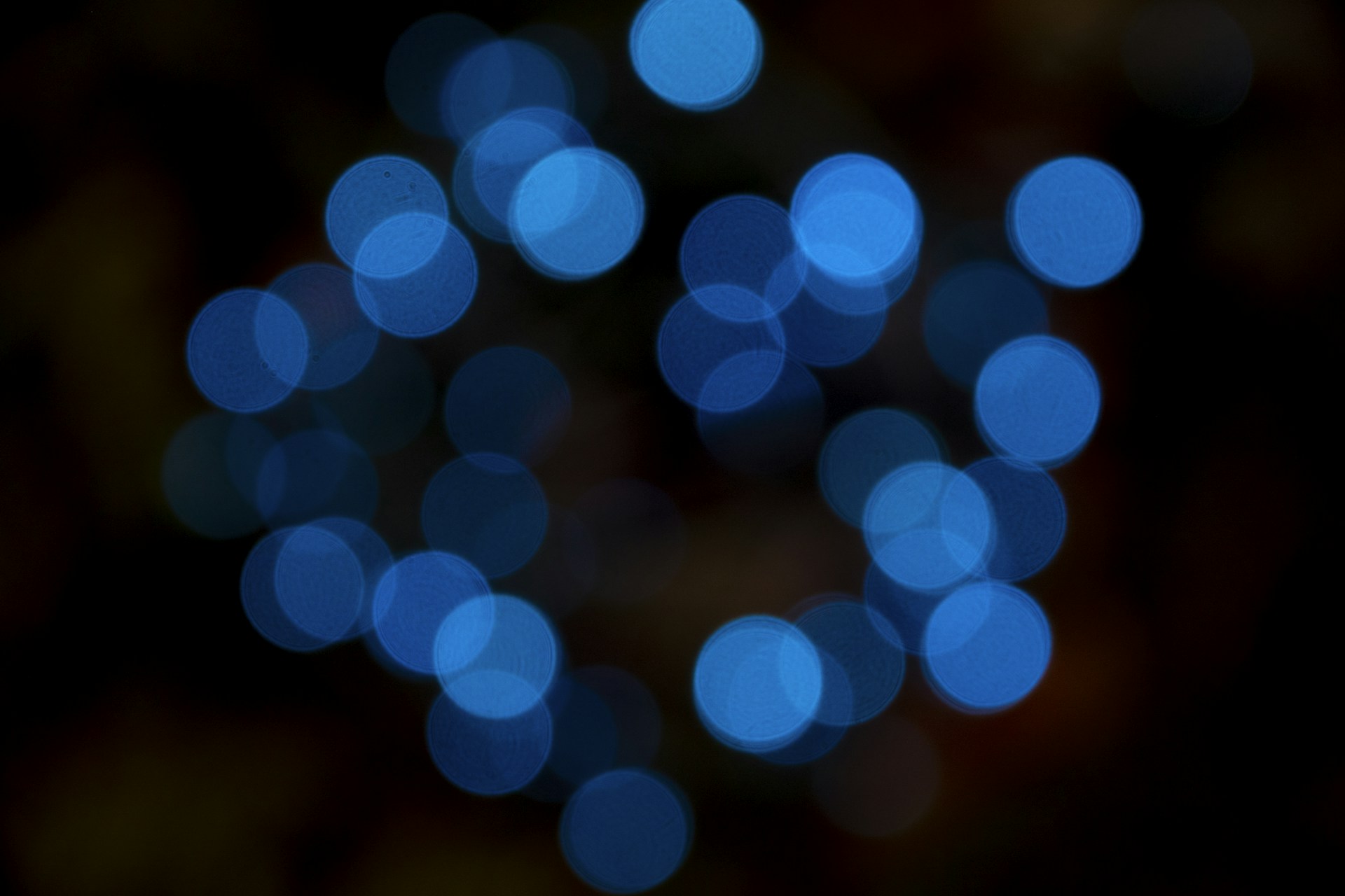 a blurry photo of blue lights in the dark
