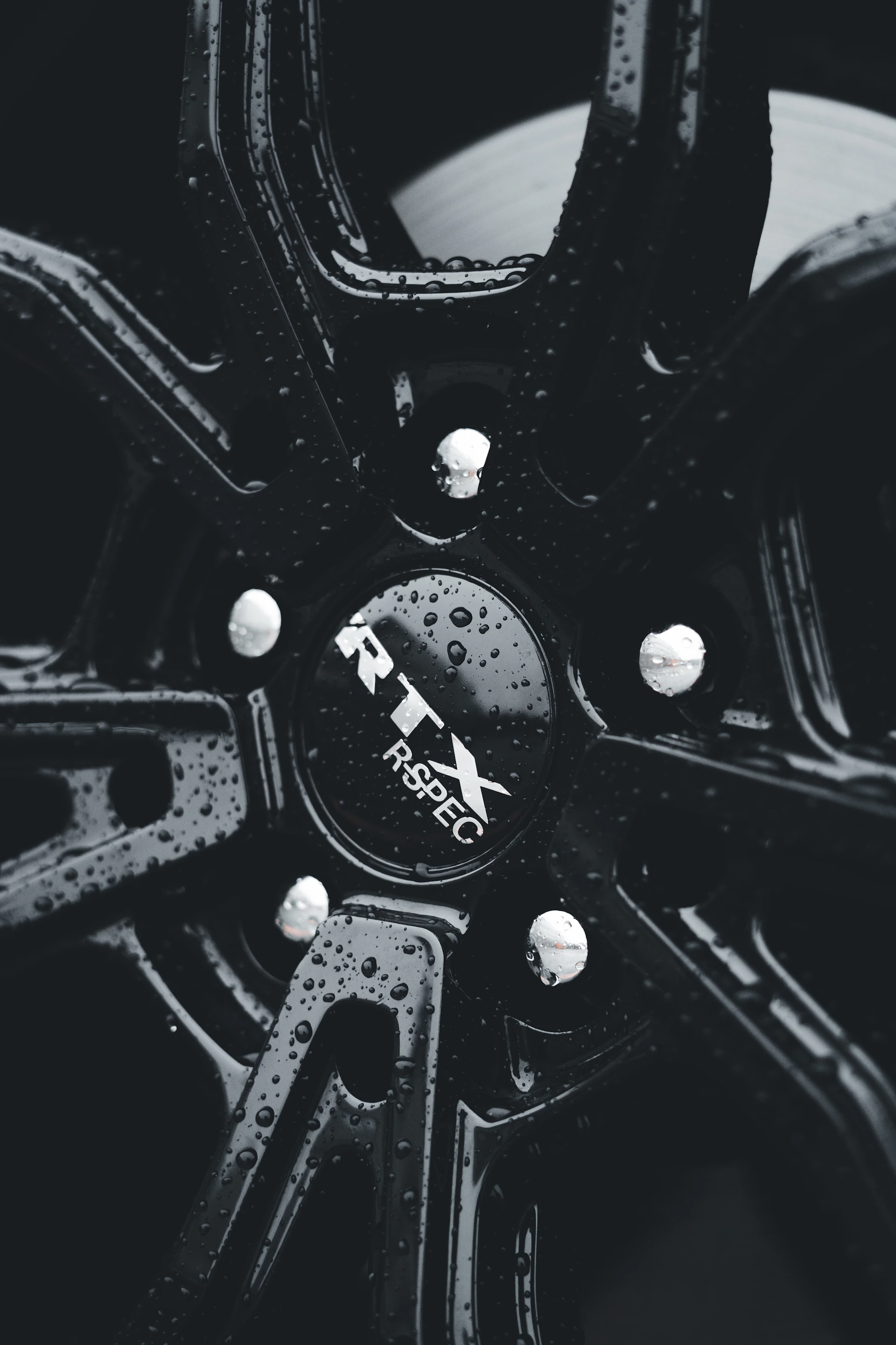 a black and white photo of a wheel