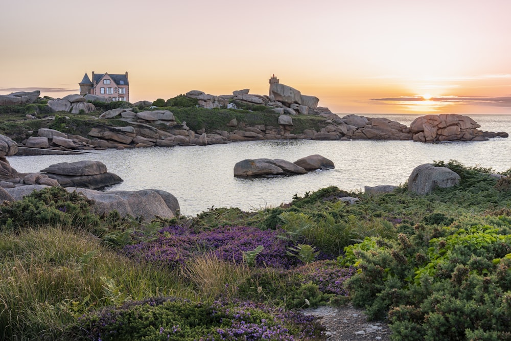 a house on a small island surrounded by water