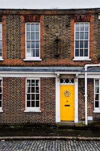 A welcoming image of a family in front of their new home.