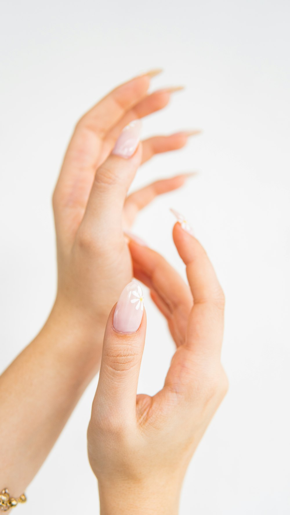 a woman's hands with a manicured nail polish