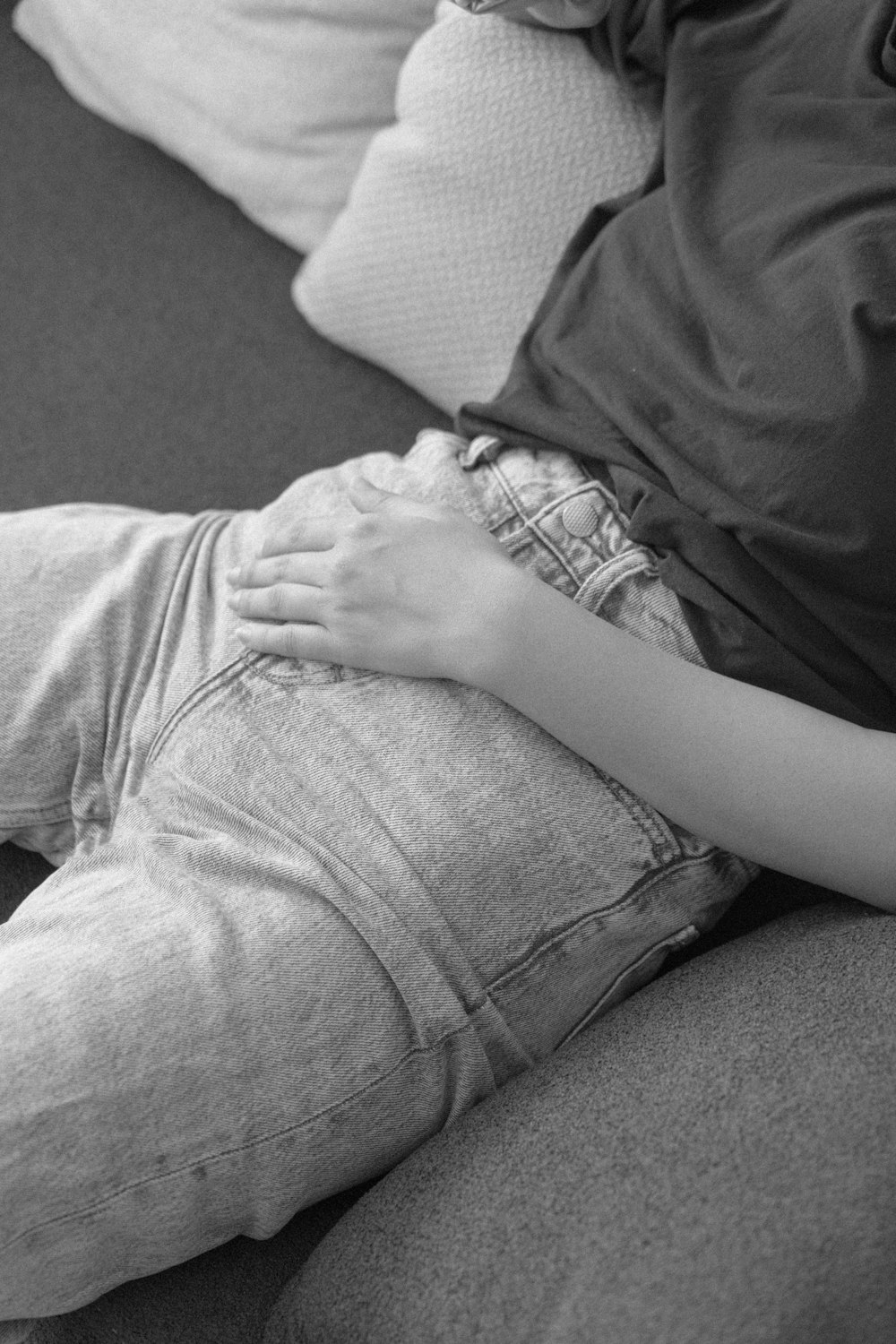a person sitting on a couch with their legs crossed