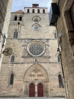 Historic church building facade with intricate stone carvings and a grand entrance