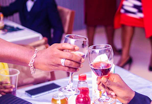 Guests clinking glasses in a joyful toast during an event