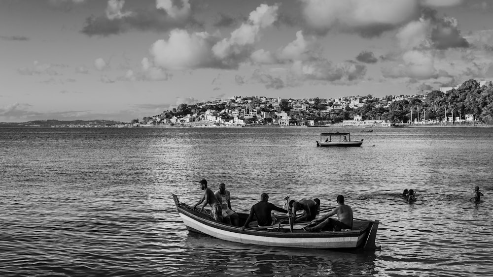 a black and white photo of a boat in the water