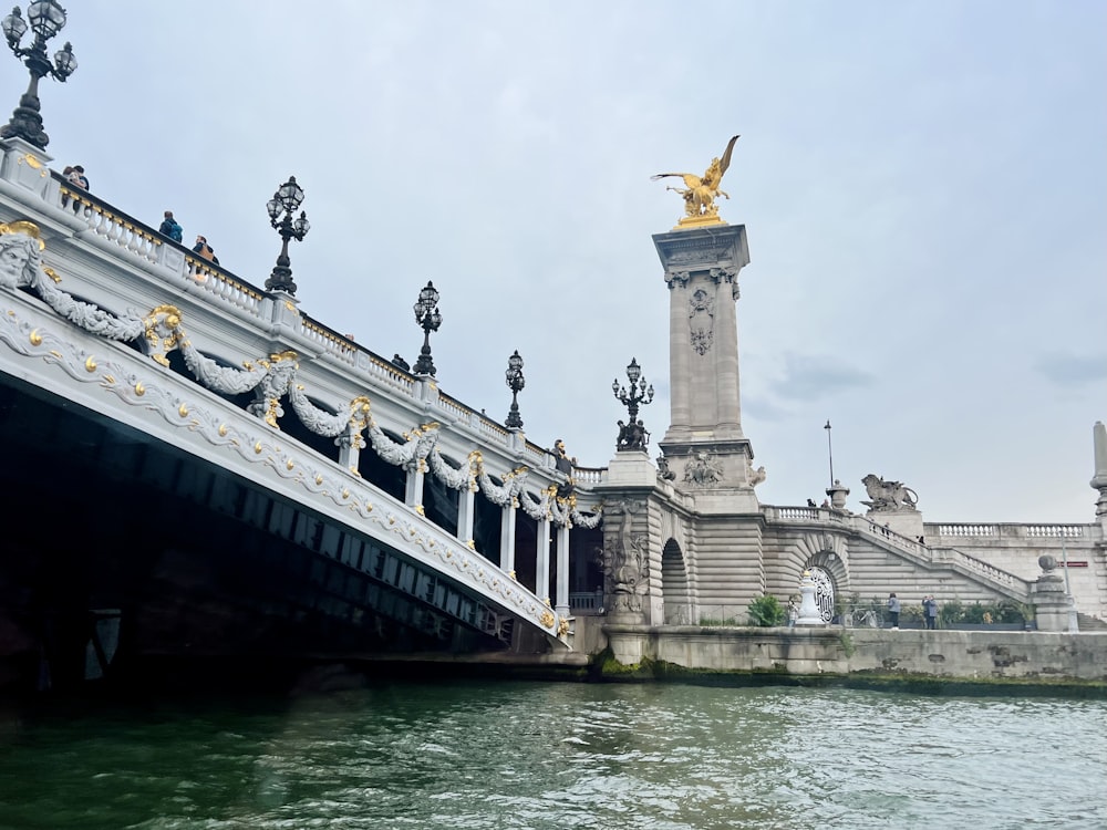 a bridge that has a statue on top of it