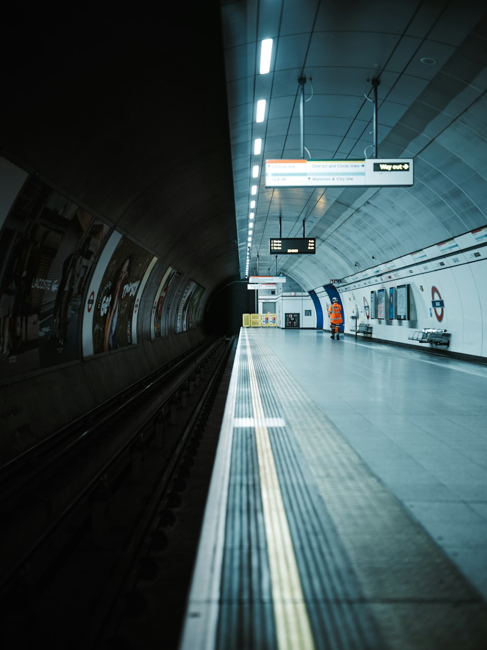 a subway station with a train pulling into it