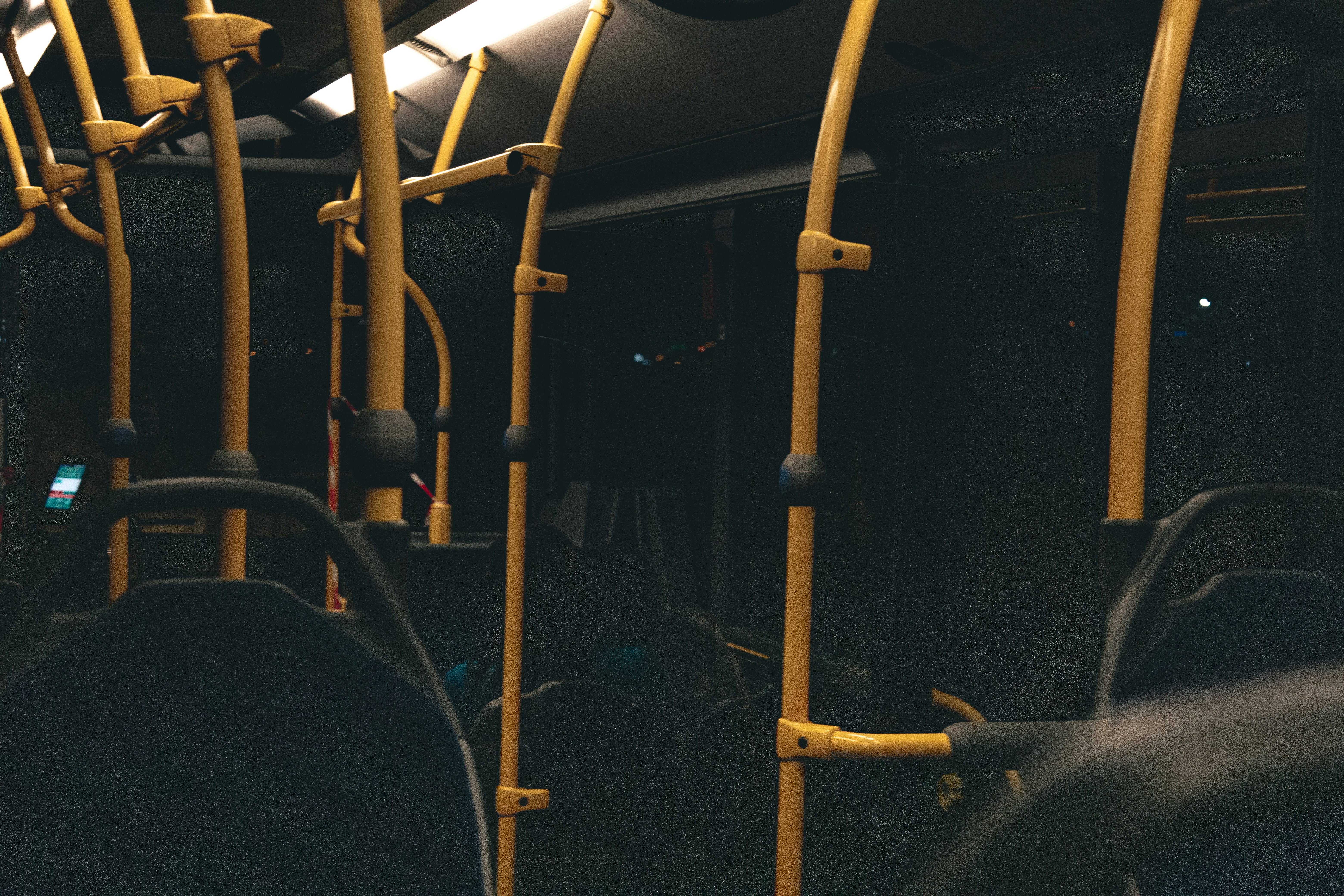 a row of empty seats on a public transit bus