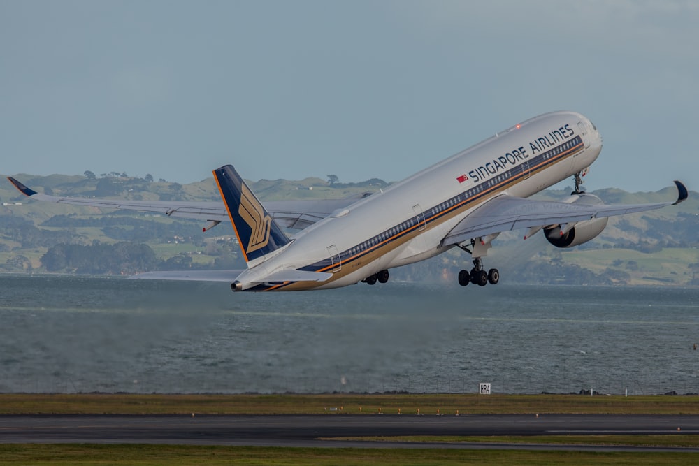 a large jetliner taking off from an airport runway