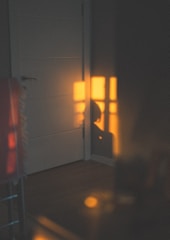 A cozy family home bathed in warm sunlight, symbolizing stability and security.