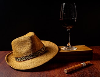 Handcrafted hats and drinks arranged on a rustic surface