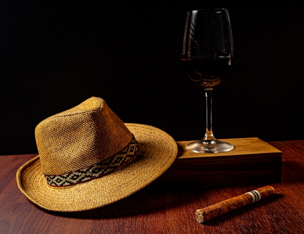 Handcrafted hats and drinks arranged on a rustic surface