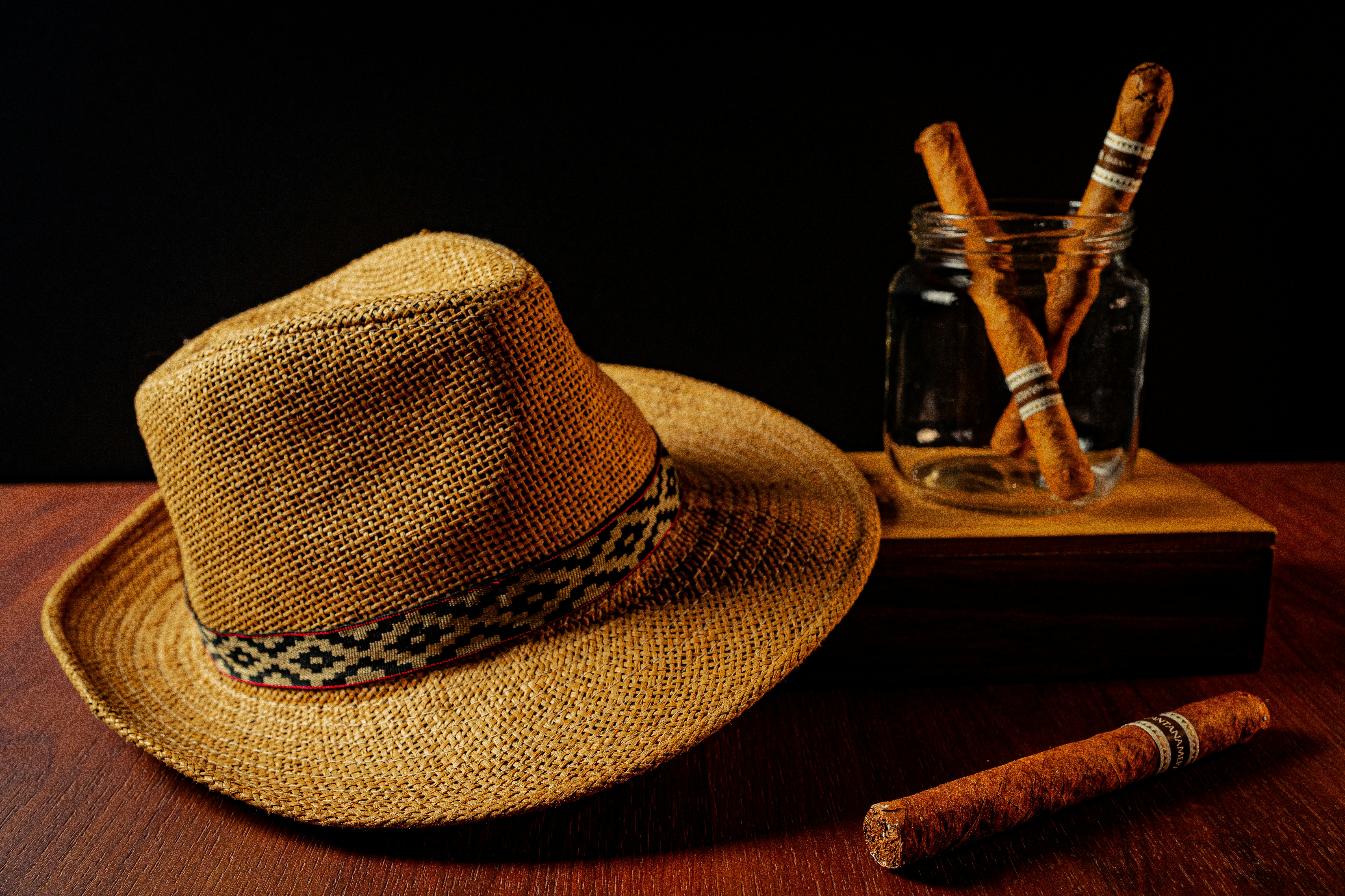 a hat and a cigar on a table