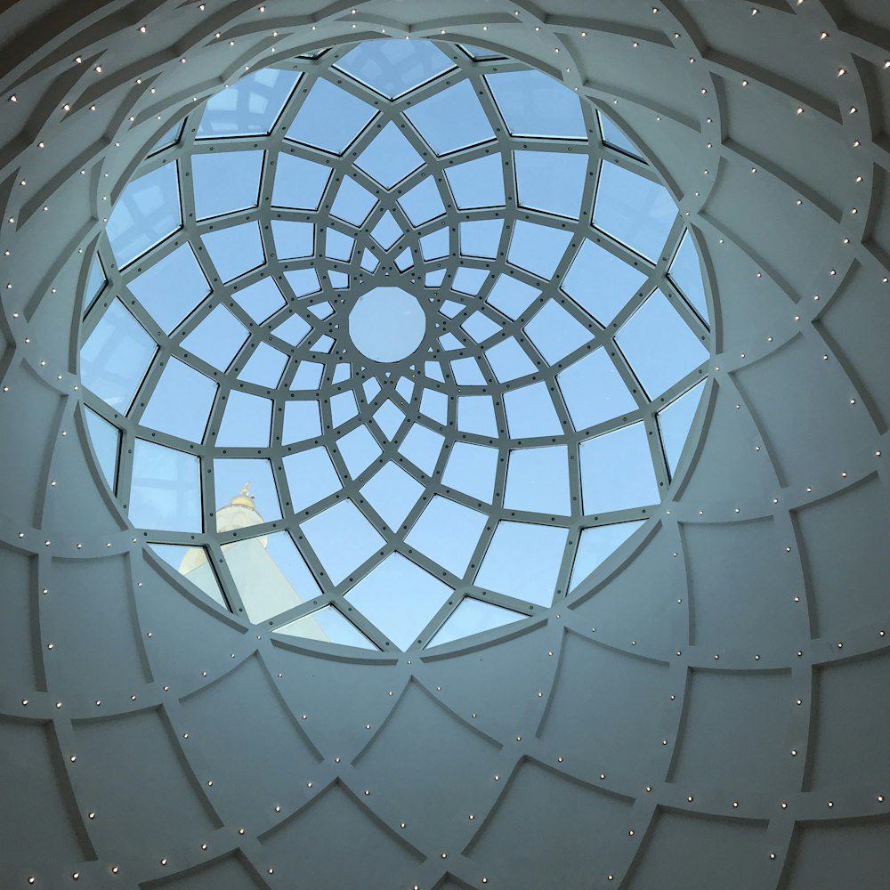 a circular window with a sky view of a building