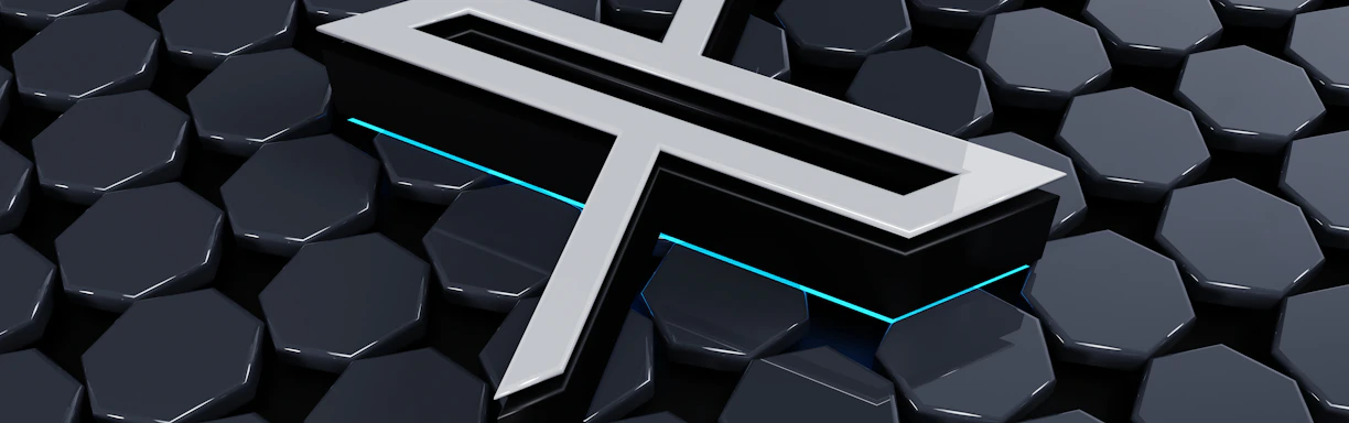 A metallic three-dimensional logo is positioned above a hexagonal tiled surface. The tiles have a glossy finish with a reflective appearance, and the logo features sharp lines and edges, with a futuristic design. Subtle neon blue lighting adds depth and contrast to the composition.