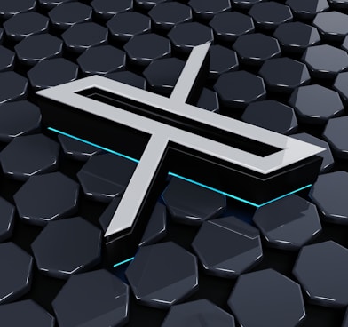 a cross on a black surface surrounded by hexagonal hexagonals