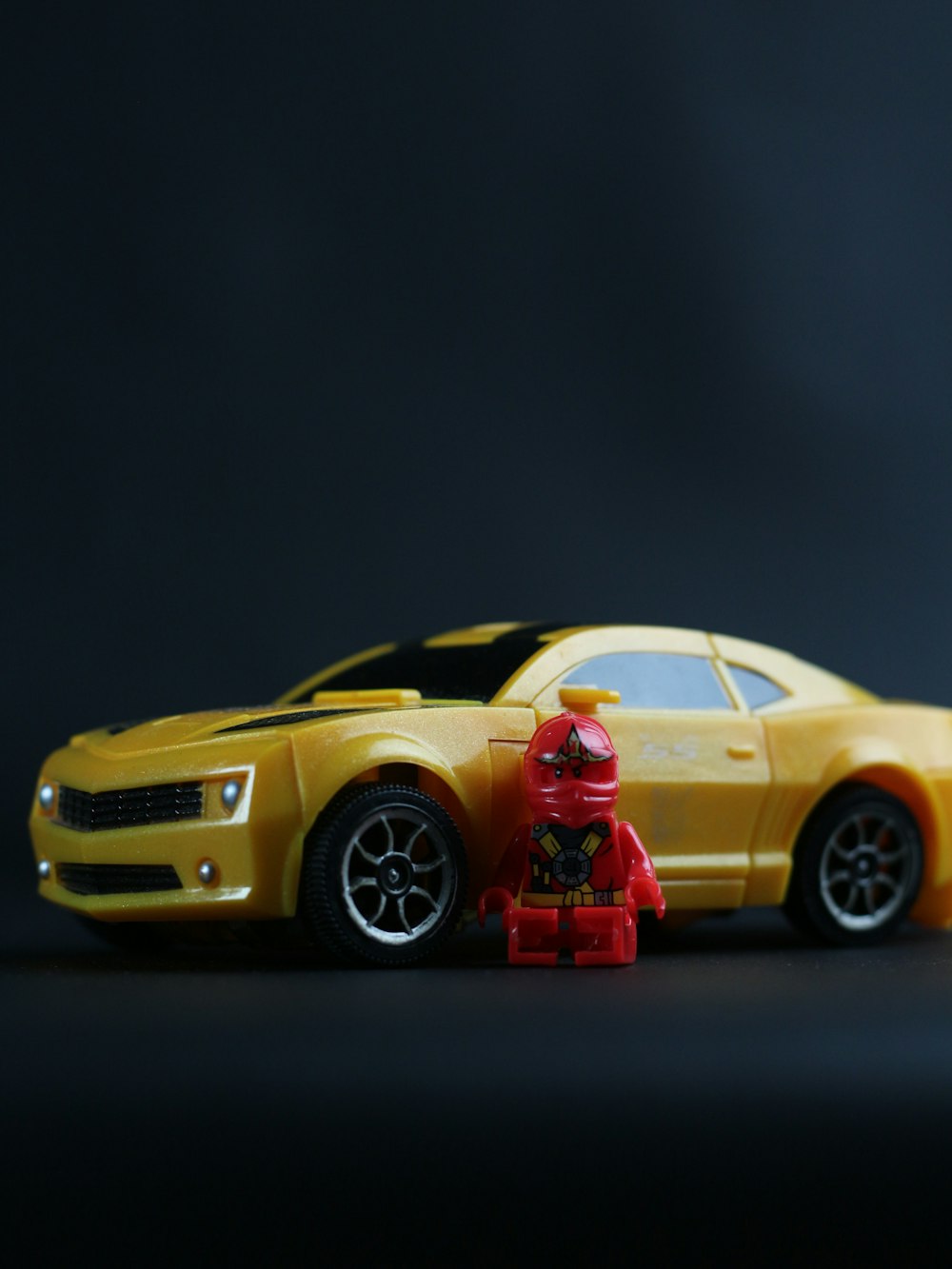 a toy car with a fire hydrant in front of it