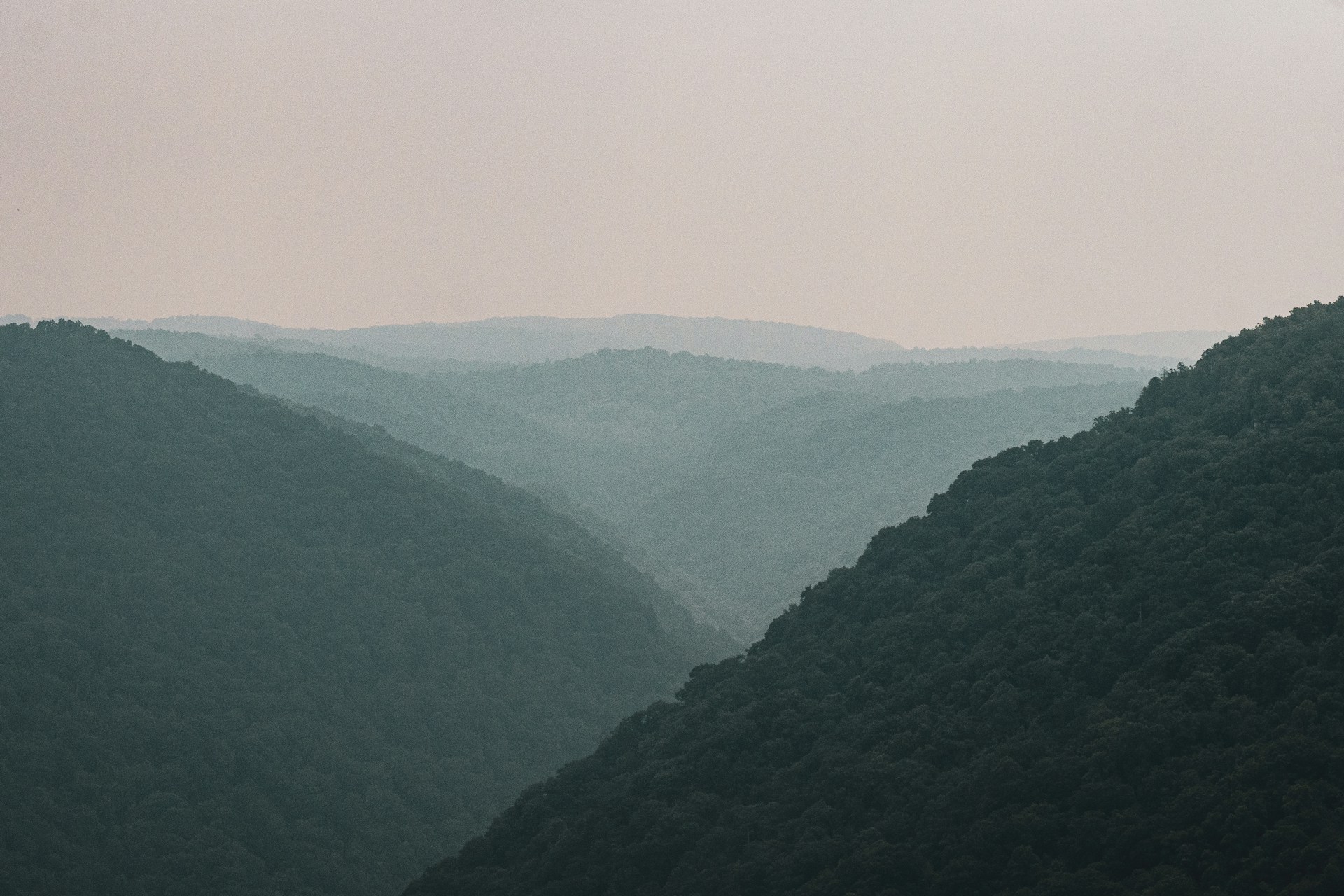 a view of a valley with mountains in the background