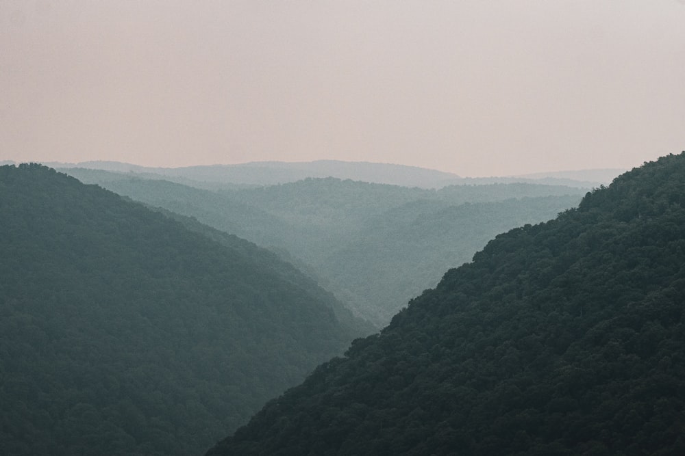 a view of a valley with mountains in the background