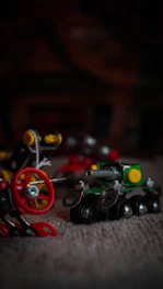 Close-up of a remote control excavator toy with detailed moving parts and a rotating arm.
