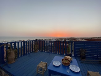 Balcony view overlooking cityscape at sunset from a Serar Residence unit