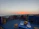 Cozy balcony overlooking Windhoek's cityscape at sunset.