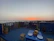 Balcony city view overlooking Nairobi skyline at sunset from a stylish Airbnb.